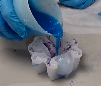 pouring resin into silicon mold