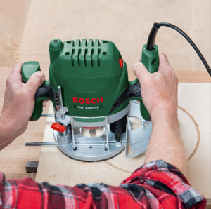 Bosch router and attachment for making circles in wood board. I use this router and attachment to make round art boards and panels.