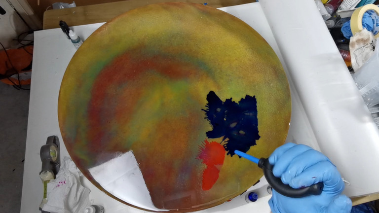 blowing alcohol ink with hand blower